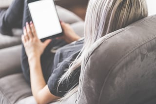 young-woman-reading-ebooks-on-her-pocket-reader-picjumbo-com.jpg