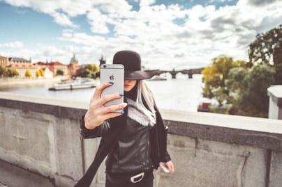 young-woman-taking-a-selfie-with-her-iphone-picjumbo-com-1.jpg